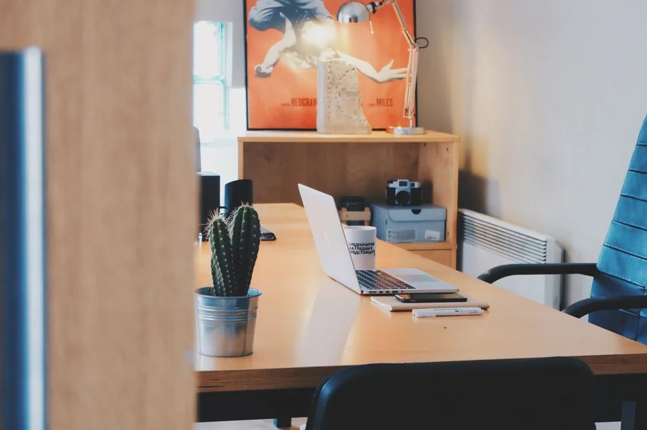 A contemporary workspace showcasing a laptop, tablet, and smartphones, ideal for tech and freelance use.